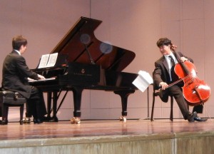 A cellist performs at a KCS recital